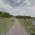 Person with dislocated shoulder at girls softball field