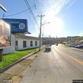 Motorist needs help changing tire on Pike Street