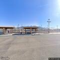 Woman lying partly off platform at Bernalillo rail station