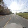 Male subject hunched over wagon on bridge on US-41A