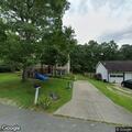Person shining red laser at home in Corbin
