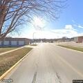 Tree limb blocks alley and hangs on utility lines