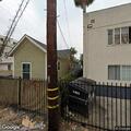 Man looking through windows and breaking gate