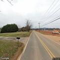 Partial downed tree causing road hazard
