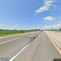 Dead deer marked on highway shoulder