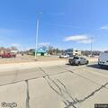 Semi backs into car at Hall and Van Dyke
