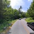 Disabled car with flat tire at Eagle Lake overlook