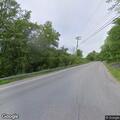 Motorcycle and pickup truck crash with horse trailer