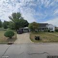 Masked men looking into cars and houses