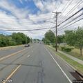 Report of drunk driver in white Tesla on Middle Country