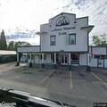 Suspicious man hiding motorcycle behind Azalea store