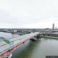 Person standing on bridge in hoodie spotted