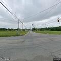 Reckless gray minivan with person hanging from window