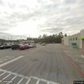 Gray car blocking traffic near AutoZone
