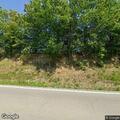 Abandoned vehicle off roadway on Leitchfield Road