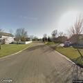 Basement house fire with smoke from roof line