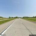 Vehicle crash with fluid leak at highway on-ramp