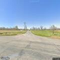Tractor trailer parked on railroad tracks at highway