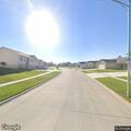 Pedestrian walking in roadway near 202nd Street in Eagle