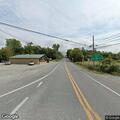Person needing medical help in vehicle near Chinese restaurant