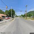 Car and motorcycle crash with injured rider