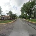 SUV runs over stop sign and crashes into yard