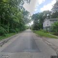Leaking fire hydrant spraying water into roadway