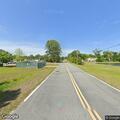 Person walking on railroad tracks near Nassau