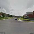 Double-parked car slowing traffic on Derwood Road
