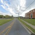 Board blocking roadway on Olin Road