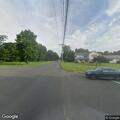 Traffic stop on gray Jaguar at Cheshire intersection
