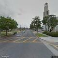 Person with back pain at church bench in San Gabriel