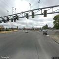 Officer checks on woman with cart near intersection