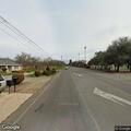 Stopped car with elderly woman in roadway lane