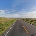 Man wearing hoodie stumbles on highway lane in Nebraska