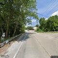 Single-car crash into guardrail with fuel leak