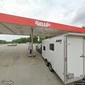 Truck repeatedly crossing center line near gas station