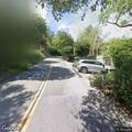 Truck and trailer briefly block Los Cerros Drive