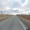 Disabled vehicle with bent axle on I-94 near Osseo