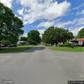 Stopped vehicle blocking road on Smith Avenue