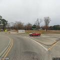 Person walking in middle of road on Raleigh Road