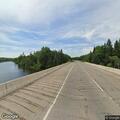 Vehicle hits guardrail on bridge, injuries unknown