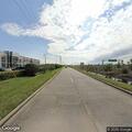 Pedestrian walking on highway shoulder in Cypress