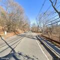 Vegetation overgrowth creating road hazard for bicyclists