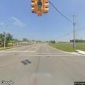 Man walking in middle of road at intersection