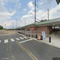 Person with feet hanging over platform at Levittown