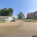 Person lying in grass at Westbrook Place in Troy