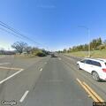 Small debris fire by building on East Highway 20