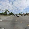 Man with injured leg leaves bicycle beside bus