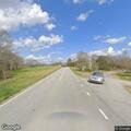 Suspicious vehicle with flashing light on rural road